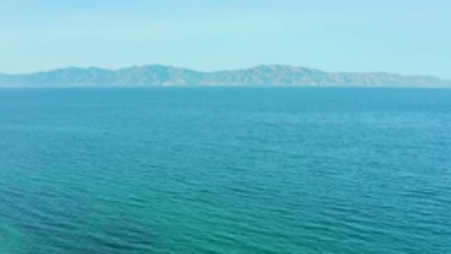 EL SARGENTO LA VENTANA MEXICO-2020: Rippling Blue Water Front With Mountains Off