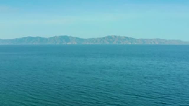 EL SARGENTO LA VENTANA MEXICO-2020: Hazy Blue And White Sky Over Aquamarine Open
