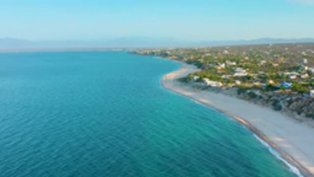 EL SARGENTO LA VENTANA MEXICO-2020: Waves Come Ashore On A Sandy Beach With An