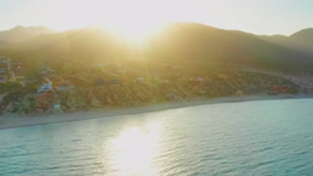 EL SARGENTO LA VENTANA MEXICO-2020: Sun On The Horizon Peeking Over Mountain