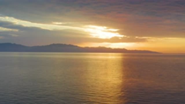 EL SARGENTO LA VENTANA MEXICO-2020: The Sun Sets Behind Mountains Lining The