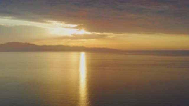 EL SARGENTO LA VENTANA MEXICO-2020: Bright Sun Peeking Through Clouds Over Ocean