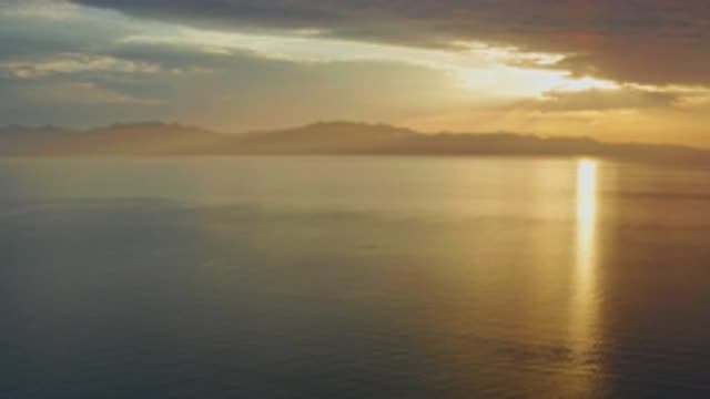 EL SARGENTO LA VENTANA MEXICO-2020: The Sun Lies Low In The Sky Over A Distant Ocean