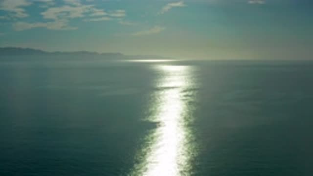 EL SARGENTO LA VENTANA MEXICO-2020: Light Shining On Body Of Water With Land In Background