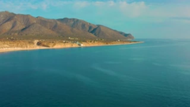 EL SARGENTO LA VENTANA MEXICO-2020: Aerial View Hovering Above Rocky Beach With Green Hills