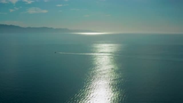 EL SARGENTO LA VENTANA MEXICO-2020: Calm Dark Ocean With One Boat Speeding