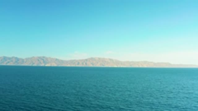 EL SARGENTO LA VENTANA MEXICO-2020: Blue Colored Water With Hill Siting And