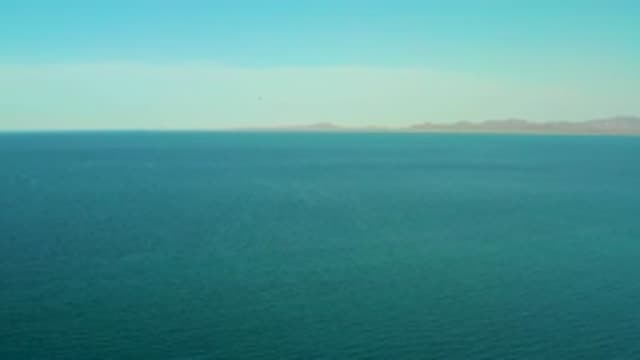 EL SARGENTO LA VENTANA MEXICO-2020: View Of Mountains Across Large Body Of Water