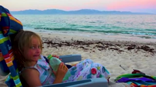 EL SARGENTO LA VENTANA MEXICO-2020: Shot Of A Child Drinking Water On The Beach