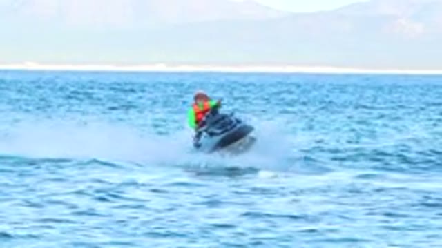 Person Riding Personal Watercraft on Ocean