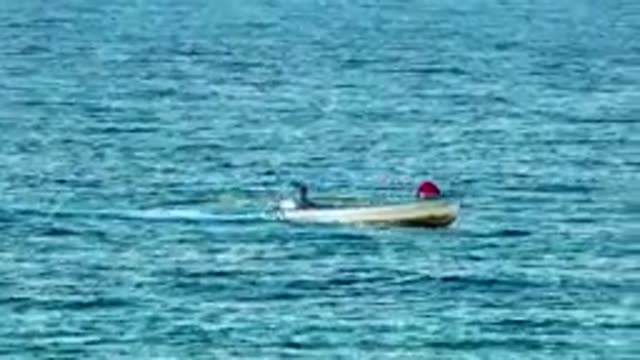 EL SARGENTO LA VENTANA MEXICO B-2020: Man Standing on Boat with Friend Fishing on Lake