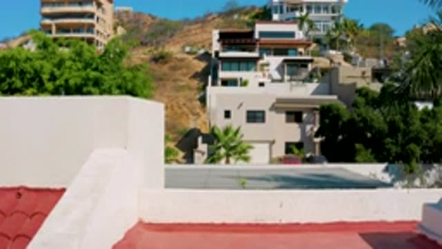 LOS CABOS MEXICO-2020: Many Buildings With Trees and Cars Present