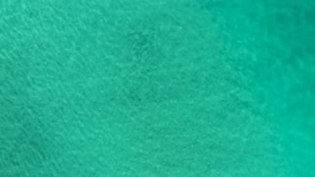 LOS CABOS MEXICO-2020: Drone Sky View Of Green Waves In The Middle Of The Ocean