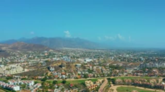 LOS CABOS MEXICO-2020: Small Village On Hill With Mountains In Background