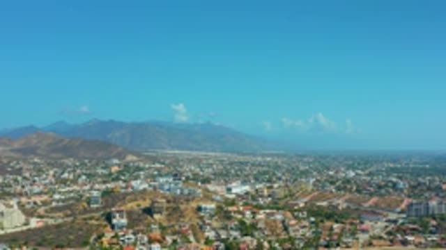 LOS CABOS MEXICO-2020: Sky Blue Houses Clouds Day Summer Mount City Peace