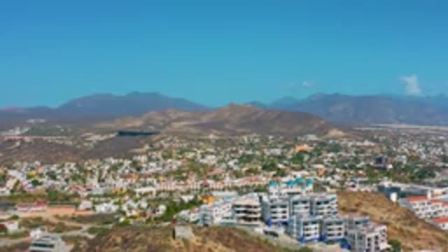 LOS CABOS MEXICO-2020: Modern Hillside Buildings in Community Under Clear Blue Sky