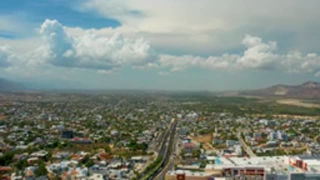 LOS CABOS MEXICO-2020: Hundreds Of Buildings And A Long Road Under A Blue Sky