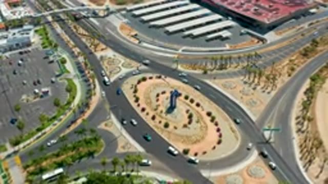 LOS CABOS MEXICO-2020: Cool Pan Shot Of Cars Traveling On The Roundabout