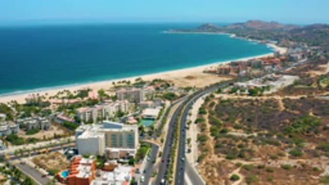 LOS CABOS MEXICO-2020: Road Going Towards Sea With Buildings On Both Sides