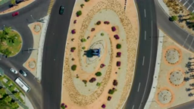 LOS CABOS MEXICO-2020: An Aerial View Of Traffic Merging Into A Roundabout