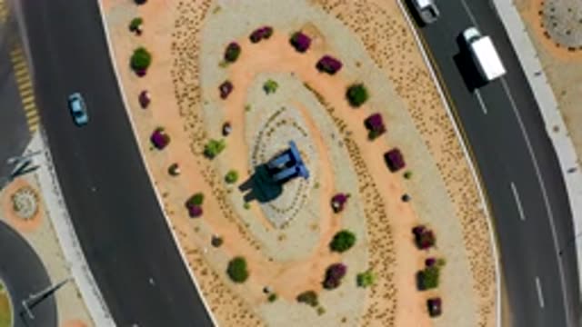 LOS CABOS MEXICO-2020: Cars Twirl Around A City Monument