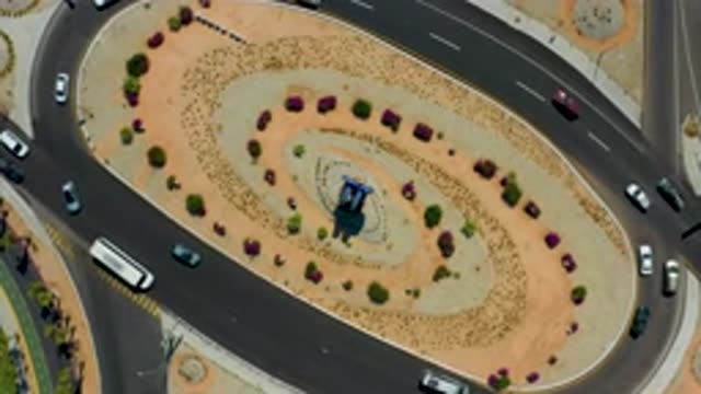 LOS CABOS MEXICO-2020: Top View Of Car Driving On Winding Roads With Passing Traffic