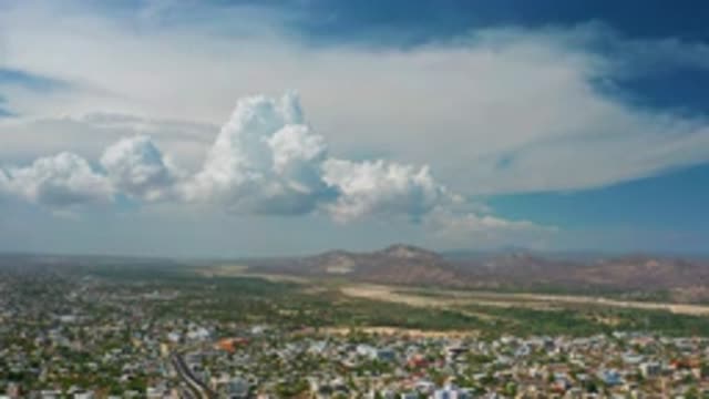 LOS CABOS MEXICO-2020: The Long View Of The Cloudy Sky And Big City Near