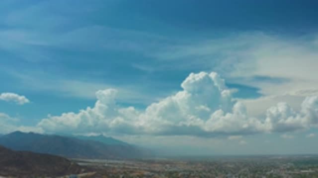 LOS CABOS MEXICO-2020: Clouds In Sky Panning Down To Ground Showing Landscape
