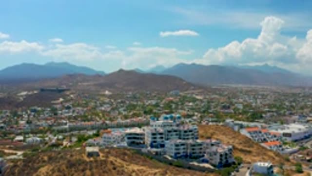 LOS CABOS MEXICO-2020: Aerial View Of A Large City As The Camera Swoops Down