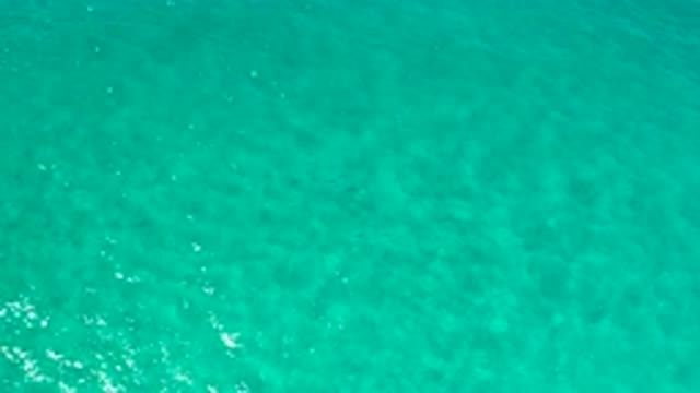 LOS CABOS MEXICO-2020: Crystal Clear Glistening Blue Ocean Water With Gentle Waves