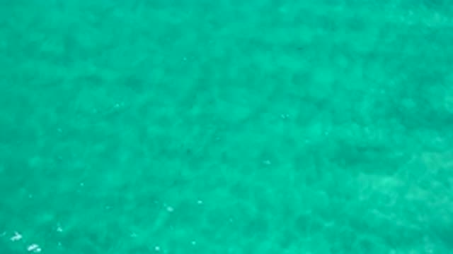LOS CABOS MEXICO-2020: Aerial View Of The Ocean With Green Emerald Clear Water
