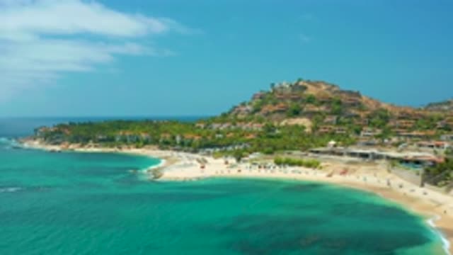 PALMILLA BEACH CABO MEXICO-2020: The Pleasant View Of The Green Mount And Blue Sea