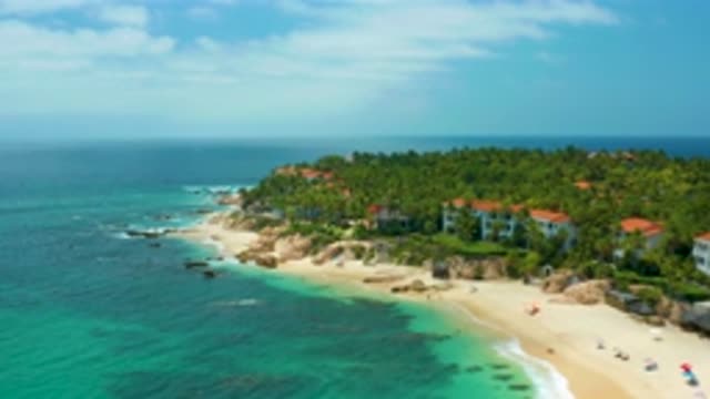 PALMILLA BEACH CABO MEXICO-2020: Aerial View Of A Beautiful Island Surrounded By Turquoise Waters And Lush Greenery