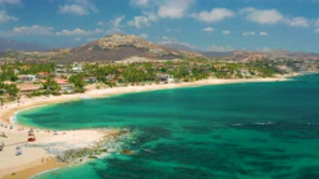 PALMILLA BEACH CABO MEXICO-2020: Coast Line Filled With Plants And Houses On A