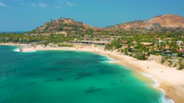 PALMILLA BEACH CABO MEXICO-2020: Aerial View Of The Shore With Sand Trees And Mountains