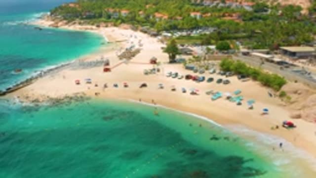 PALMILLA BEACH CABO MEXICO-2020: Calm Water Engulfing A Tropical Island Filled