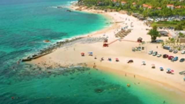 PALMILLA BEACH CABO MEXICO-2020: People Sitting On The Edge Of The Beach