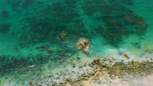 PALMILLA BEACH CABO MEXICO-2020: Rocks and More Rocks Under the Green Sea