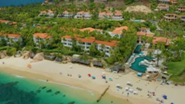 PALMILLA BEACH CABO MEXICO-2020: Large Hotel Like Buildings Sit On The Edge Of A Sandy Beach