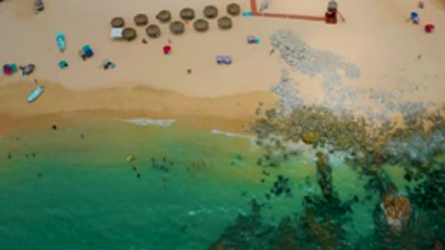 PALMILLA BEACH CABO MEXICO-2020: Top View Of Rocks At Beach And Humans
