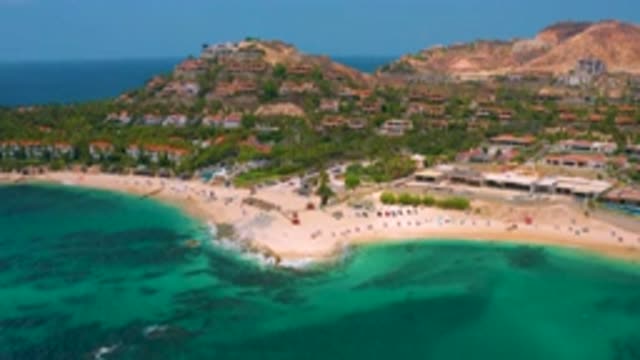 PALMILLA BEACH CABO MEXICO-2020: Murky Dark Blue Water Pushing Against A