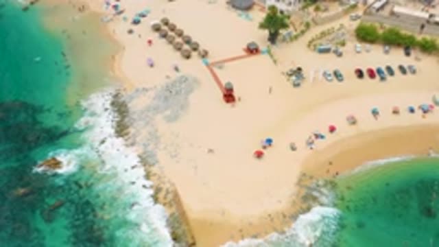 PALMILLA BEACH CABO MEXICO-2020: Sandy Beach With Beach-Goers And Green Water