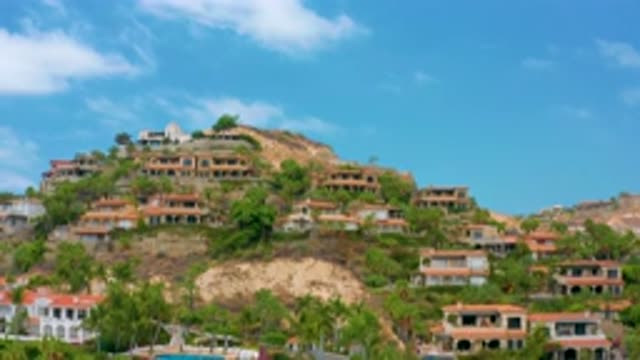 PALMILLA BEACH CABO MEXICO-2020: Homes Built On The Side Of A Hill Populated
