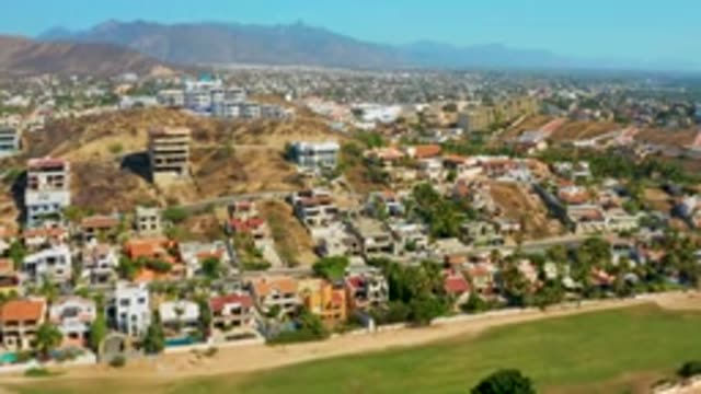 SAN JOSE DEL CABO MEXICO-2020: Flying Over Buildings In Densely Populated City