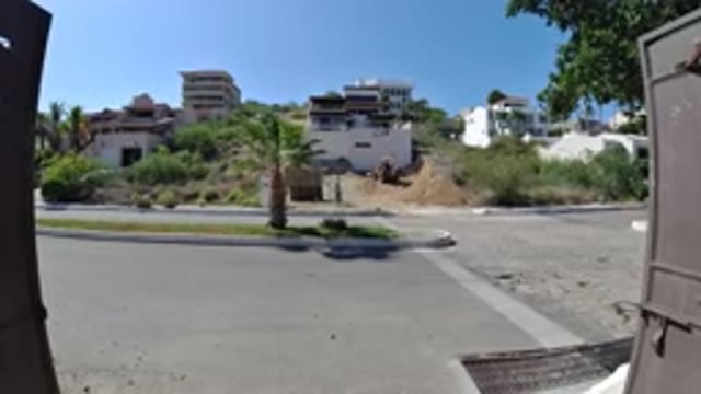 LOS CABOS MEXICO-2019: View From A House Of A Street With Palm Trees Swaying In