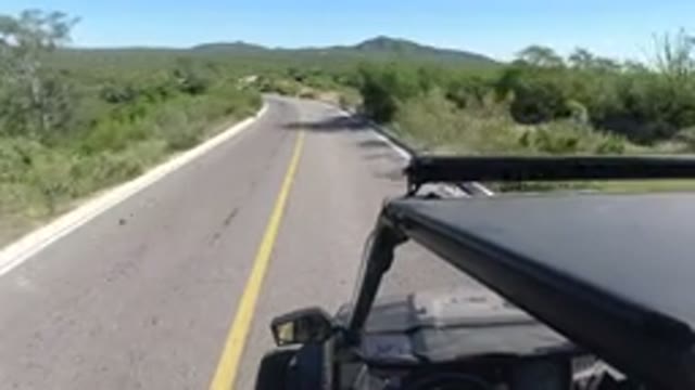 LOS CABOS MEXICO-2019: Car Driving On A Road In The Middle Of The Desert