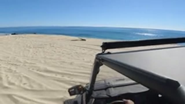LOS CABOS MEXICO-2019: Boy Walking On Clean Dunes Near The Sea