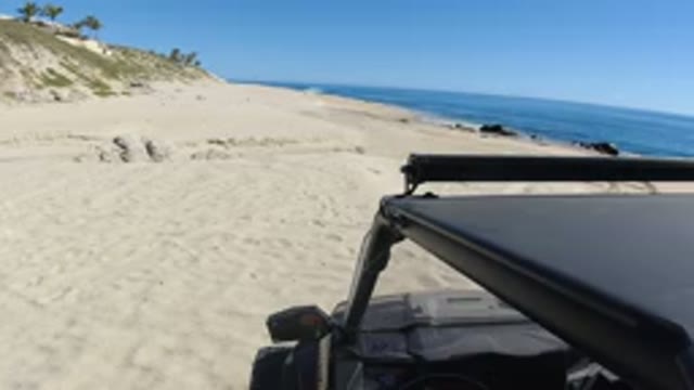 LOS CABOS MEXICO-2019: Jeep With Light Bar On Beach Looking Out At A Beautiful