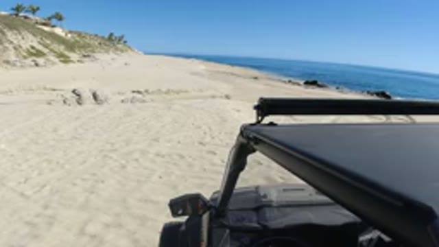 LOS CABOS MEXICO-2019: Sandy Beach Day Adventures Grabbing Gear From The Vehicle