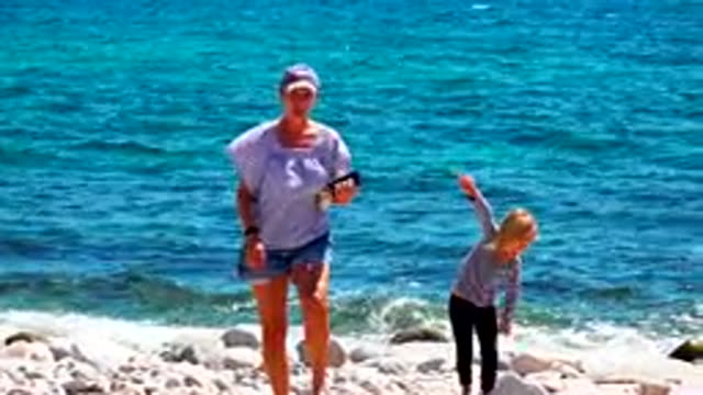 EL SARGENTO LA VENTANA MEXICO-2020: Mom And Daughter Walking In A Rock Beach
